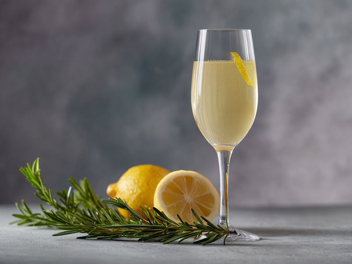 A light yellow drink served in a champagne glass. Created by AI. Edited by Pernod Ricard Sweden